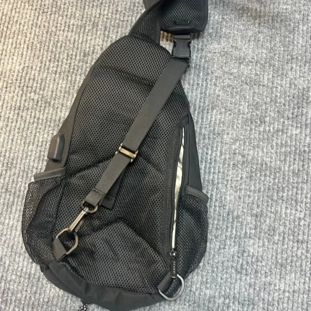 Black Sling Backpack Crossbody Shoulder Bag with Bungee Cord and Headphone Port